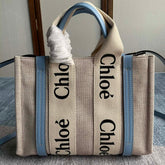 SMALL STRAP WOODY TOTE BAG 26.5 IN BEIGE LINEN CANVAS BLACK WEBBING LOGO EMBROIDER BLUE CALFSKIN