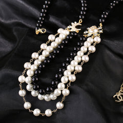 CHANEL 25S CHAIN BELT IN WHITE AND BLACK PEARL 614477