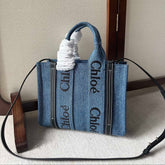 SMALL WOODY TOTE BAG 26.5 IN BLUE DENIM BLACK CALFSKIN
