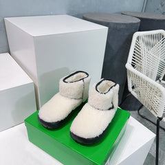 MINI ANKLE BOOT IN WHITE SHEARLING WITH BLACK ULTRA LIGHTWEIGHT RUBBER OUTSOLE