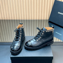 CHANEL 25S MARTIN LACE-UP BOOTS WITH CHAIN DETAIL IN BLACK CALFSKIN