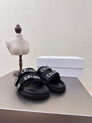 CELINE 25S FLAT SANDALS ARC DE TRIOMPHE IN BLACK CALFSKIN AND CANVAS