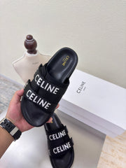 CELINE 25S FLAT SANDALS ARC DE TRIOMPHE IN BLACK CALFSKIN AND CANVAS