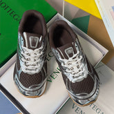BOTTEGA VENETA 26S SNEAKERS IN DARK BROWN AND SILVER TPU MATERIAL