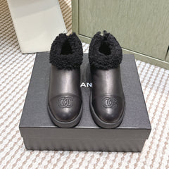 CHANEL 25S SHORT BOOTS IN BLACK CALFSKIN WITH SHEEPSKIN LINING