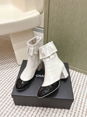CHANEL 25S ANKLE BOOTS IN WHITE CALFSKIN AND BLACK GLOSSY TOE RUCHED