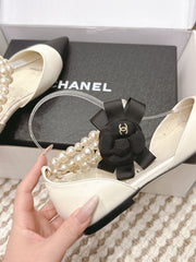 CHANEL 25S ESPADRILLE FLATS IN WHITE AND BLACK CALFSKIN WITH PEARL STRAP