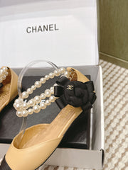 CHANEL 25S ESPADRILLE FLATS IN BEIGE AND BLACK CALFSKIN WITH PEARL STRAP
