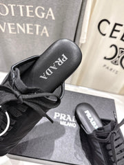 PRADA 25S MULES IN BLACK WITH METAL TOECAP