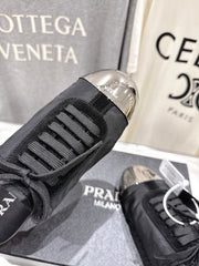 PRADA 25S MULES IN BLACK WITH METAL TOECAP