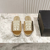 ALAIA PERFORATED SLIDE SANDALS 25S IN LIGHT GOLD LAMBSKIN