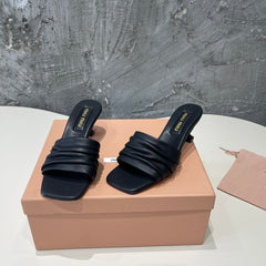 HIGH - HEEL BLACK SHEEPSKIN WITH STYLIZED STRAPS