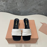 HIGH - HEEL WHITE MIX BLACK SHEEPSKIN WITH STYLIZED STRAPS