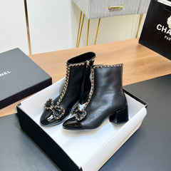 CHANEL 25S HEELED CHAIN BOOTS WITH BOW IN BLACK CALFSKIN GOLD HARDWRE
