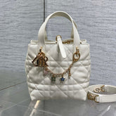 DIOR 25S TOUJOURS VERTICAL TOTE BAG 18 IN IVORY CALFSKIN WITH CHARM BRACELET STRAP