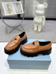 PRADA 25S THICK-SOLE LOAFERS 60 MM IN COGNAC BROWN CALFSKIN