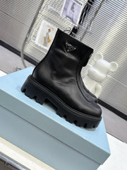 PRADA 25S ZIP-UP ANKLE BOOTS IN BLACK CALFSKIN