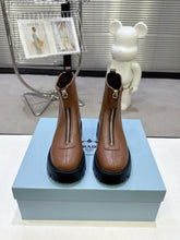 PRADA 25S ZIP-UP ANKLE BOOTS IN BROWN CALFSKIN