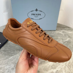 PRADA 25S MONTECARLO ANTIQUED SNEAKERS IN CARAMEL NAPPA LEATHER