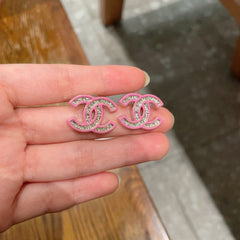 DOUBLE C STUD EARRINGS WITH PINK TRIM AND CENTER STONE