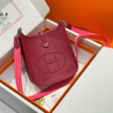 HERMES 25S MINI EVELYNE 18 IN BURGUNDY PATTERNED STRAP CALFSKIN SILVER HARDWARE
