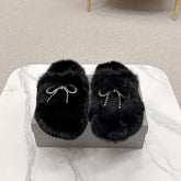BALENCIAGA 25S SOFT FUR SLIPPERS IN BLACK FUR WITH RHINESTONE BOW