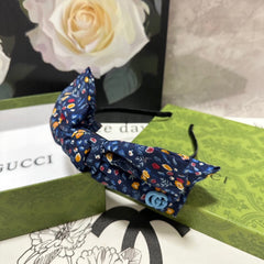 HAIRBAND IN NAVY BLUE FLORAL FABRIC 385854