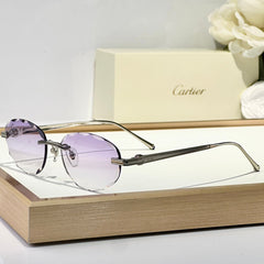 C DE RIMLESS ROUND FRAME SUNGLASSES CT0611S IN METAL