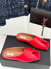 ALAIA FLAT MULE IN CRIMSON RED LAMBSKIN