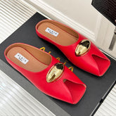 ALAIA FLAT MULE IN CRIMSON RED LAMBSKIN WITH GOLD HARDWARE