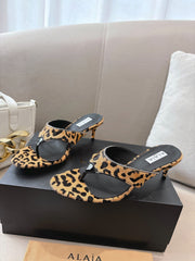 ALAIA HEELED THONG 25S 55 MM IN LEOPARD PONY HAIR LEATHER