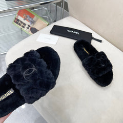 CHANEL 25S FUR SLIPPERS WITH EXPOSED-STITCH STRAPS IN BLACK