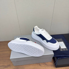 PRADA 25S DOWNTOWN BOLD SNEAKERS 45MM IN WHITE AND NAVY BLUE CALFSKIN