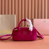 ARCADIE BAG 22 IN FUCHSIA SUEDE GOLD HARDWARE
