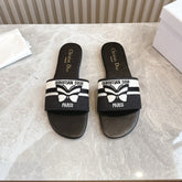 DIOR FLAT SLIDES 25S IN BLACK CALFSKIN AND FABRIC BRAND NAME EMBROIDERY