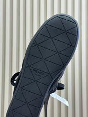 PRADA 25S COLLAPSE FLAT SHOES IN BLACK CALFSKIN
