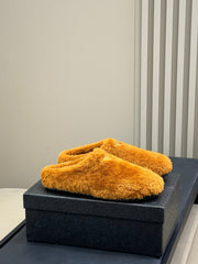 PRADA 25S CLOGS IN DARK ORANGE SHEARLING