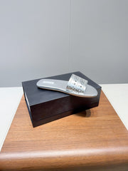 ALAIA FLAT SANDALS WITH PERFORATED STRAPS 25S IN SILVER LAMBSKIN