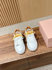 MM SNEAKERS IN WHITE CALFSKIN WITH YELLOW LACES