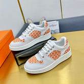 FREE SNEAKER IN WHITE CALFSKIN AND "H EN BIAIS" ORANGE CANVAS