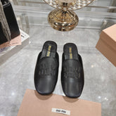 MULES SLIPPERS BLACK COWHIDE