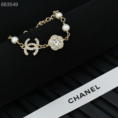 CC BRACELET 25P IN GOLD METAL PEARLY WHITE AND CRYSTAL