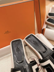0RAN SANDALS IN BLACK CALFSKIN AND WHITE CANVAS
