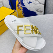 FENDI GRAPHY LOGO LETTERING SLIDES IN WHITE LAMBSKIN WITH GOLD HARDWARE