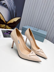 PRADA 26S POINTED TOE PUMPS STILETTO HEEL 95MM IN NUDE BEIGE PATENT CALFSKIN LOGO