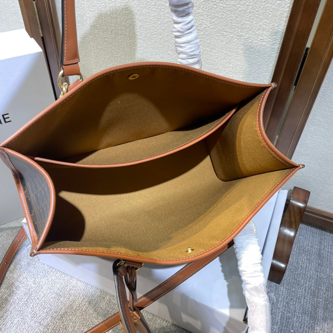 CELINE 25S HORIZONTAL CABAS 34MM IN BLACK TRIOMPHE CANVAS AND BROWN CALFSKIN