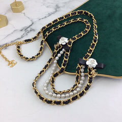 CHANEL 25S CHAIN BELT IN WHITE PEARL AND BLACK CALFSKIN 614403