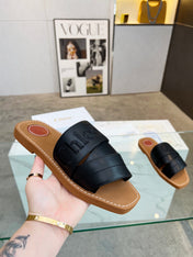 CHLOÉ WOODY MULE IN BLACK LAMBSKIN WITH EMBROIDERED LOGO