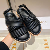 CROSS STRAP SANDAL IN BLACK RUBBER WITH GOLD HARDWARE