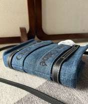 MINI WOODY TOTE BAG 20 IN BLUE DENIM BLACK CALFSKIN